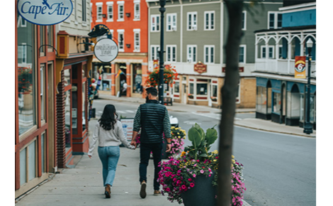 Gift card image of a couple walking through town