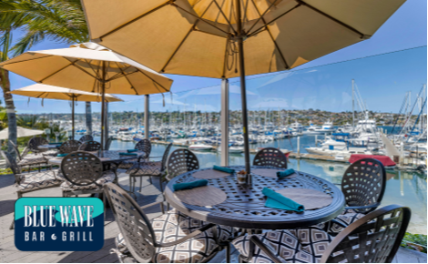 eGift card image of the view from the restaurant looking out to the marina and the Blue Wave Bar & Grill logo