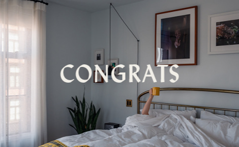 eGift card image of a hotel suite with the text 